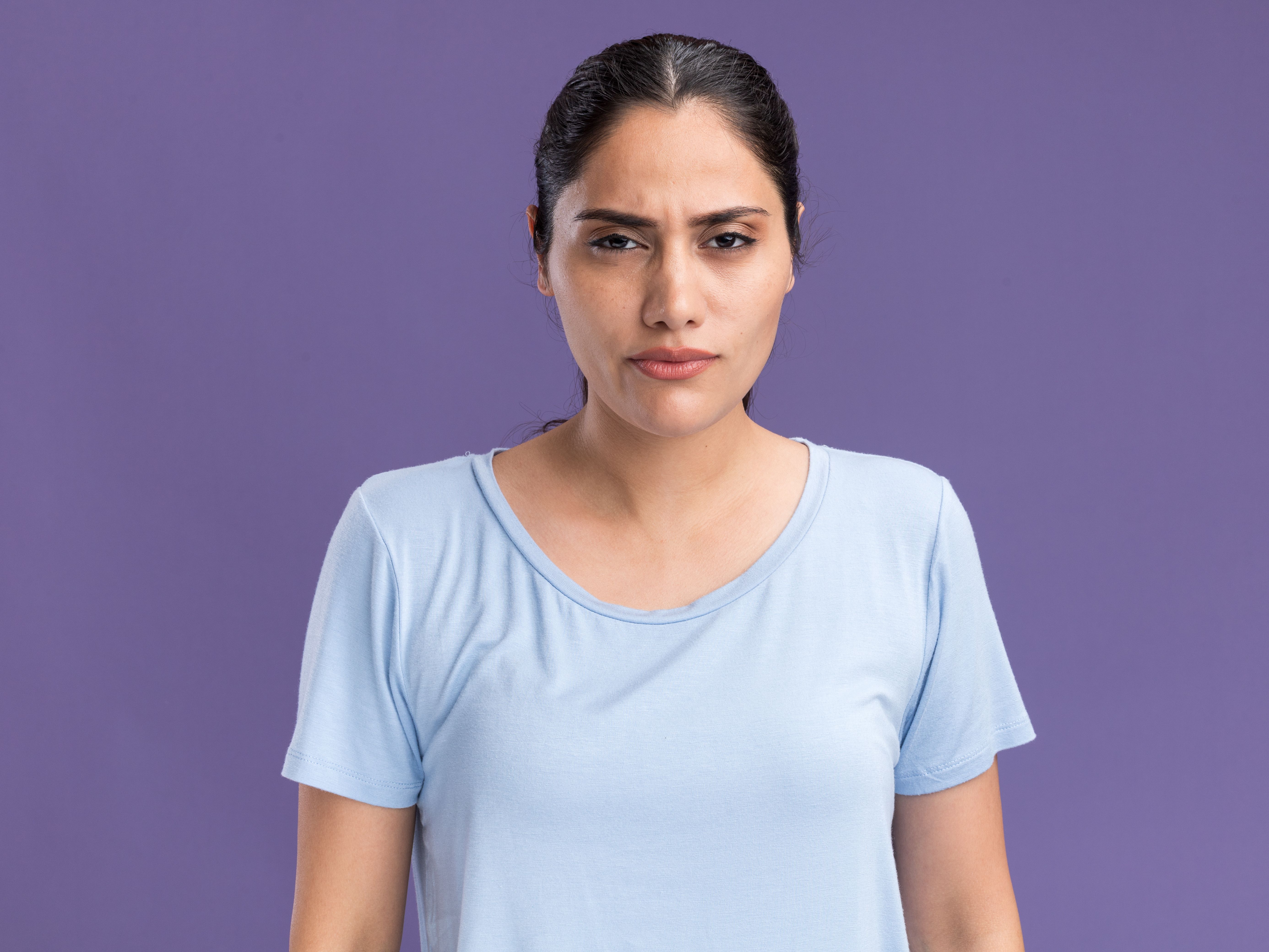 serious young brunette caucasian girl looking camera